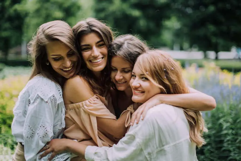 Women Hugging and Smiling, friendship