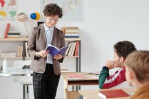 A Woman Holding a Notebook, teacher