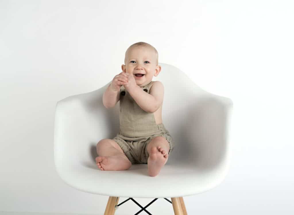 Baby Sitting on White Chair, happy baby
