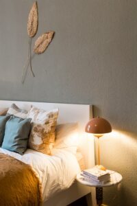 happy thoughts before bed, white and blue throw pillow on white bed