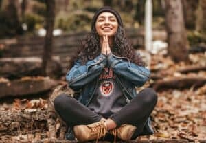 woman sitting cross legged in a meditative pose