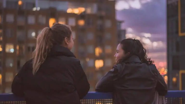 two women standing near railings, how to disagree respectfully